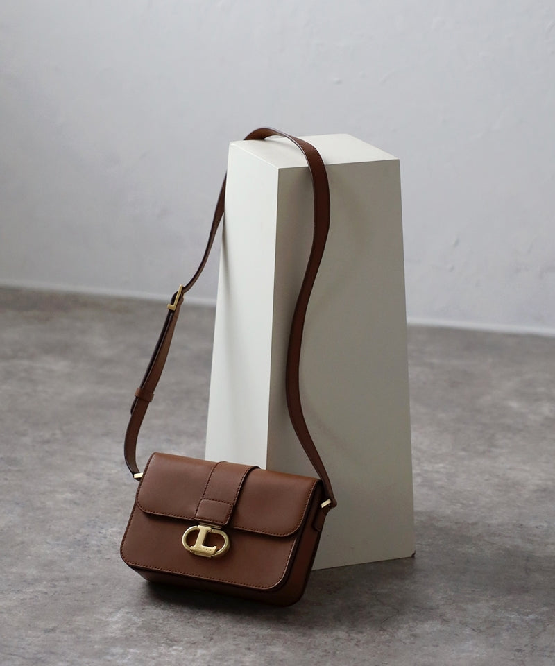 Genuine leather shoulder bag with logo buckle